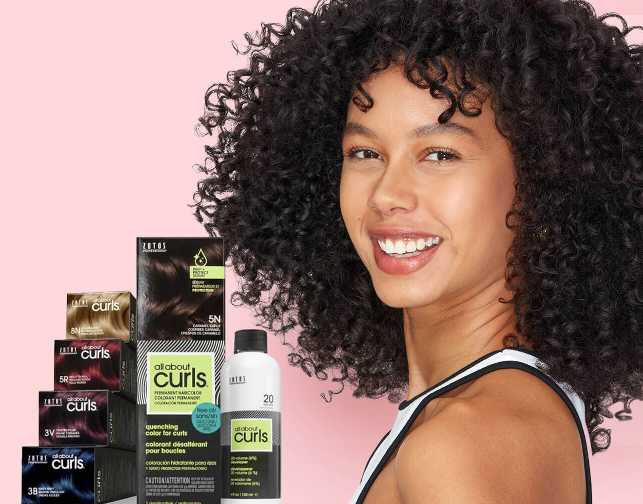 Curly hair model with products on pink background