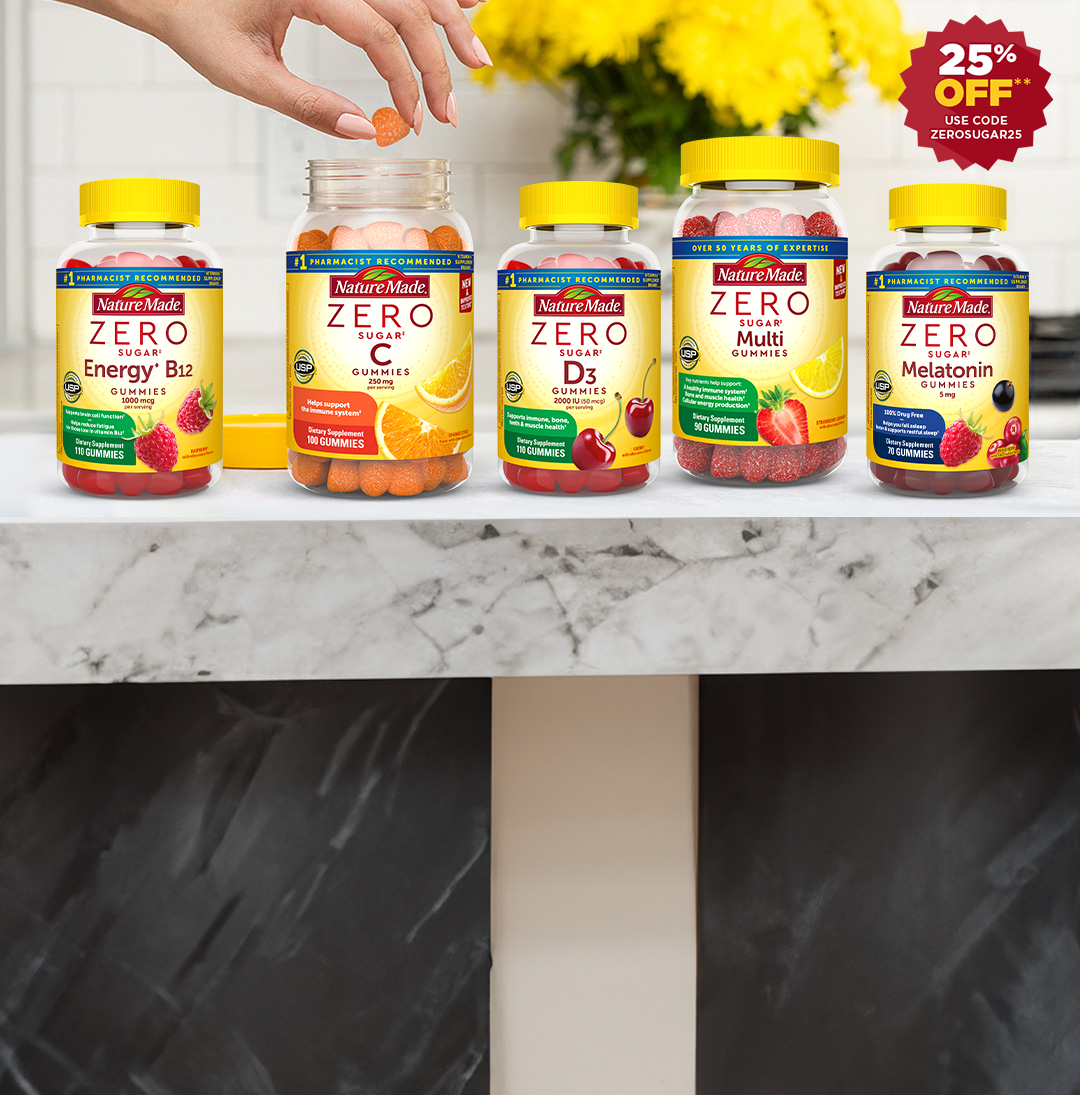 Person in a yellow top reaching for a gummy from an open bottle of Nature Made Zero Sugar vitamins on a kitchen counter. Red burst with text that reads 25% off use code ZEROSUGAR25