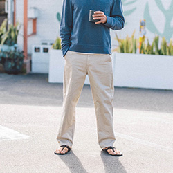 Close up of a bottom part of a man wearing gray pants