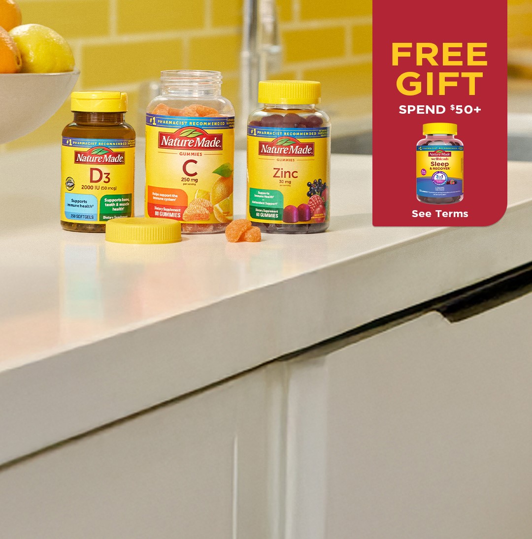 Nature Made Vitamin D3, Vitamin C gummies, and Zinc supplements on a kitchen counter. Free Gift Sleep & Recover™ Gummies. Spend $50+. See Terms.