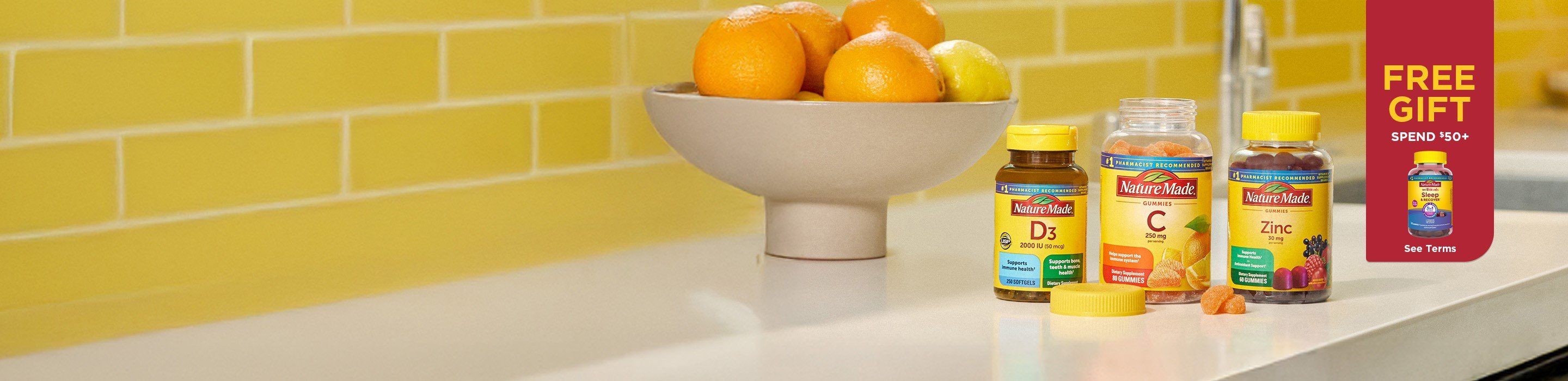 Nature Made Vitamin D3, Vitamin C gummies, and Zinc supplements on a kitchen counter. Free Gift Sleep & Recover™ Gummies. Spend $50+. See Terms.