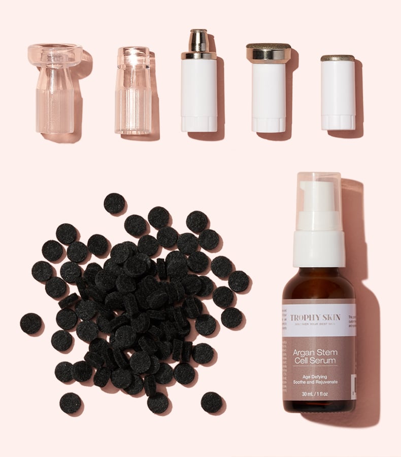 MiniMD Boose Set: MiniMD, Tips, Replacement Fillers, and Anti-Aging Serum on Pink Background