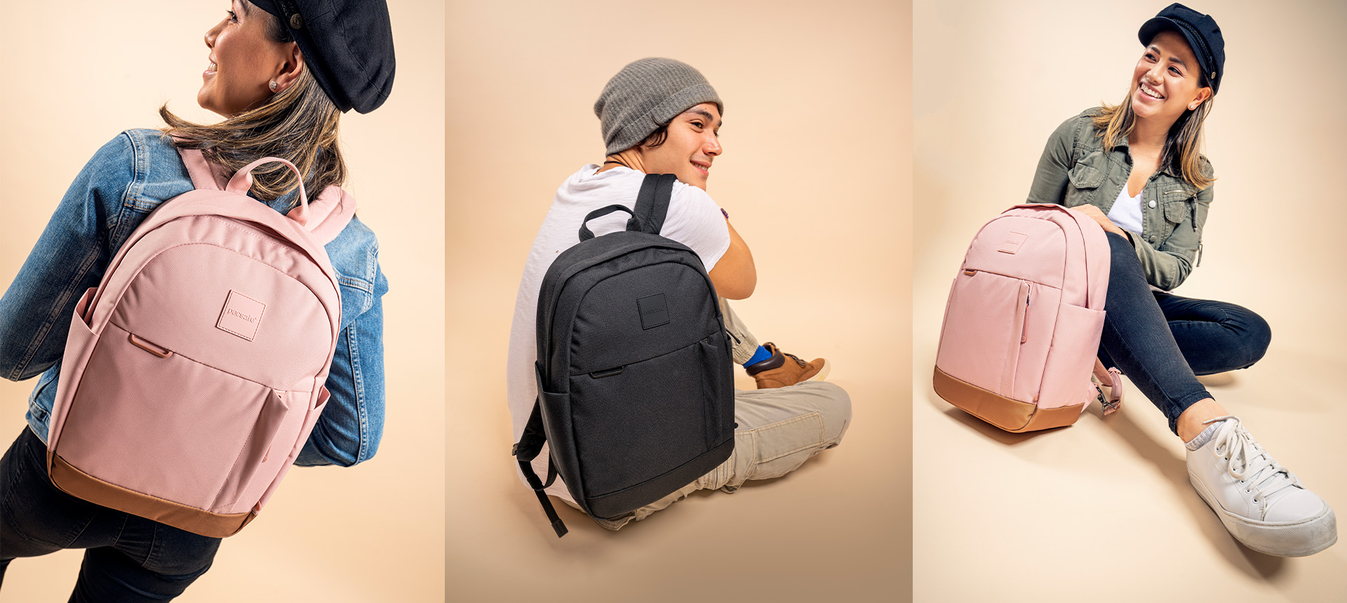 Female model wearing the Pacsafe Go 15L anti-theft backpack in Sunset Pink; Male model wearing on one shoulder backpack in Black; Female model sitting by the backpack in Sunset Pink