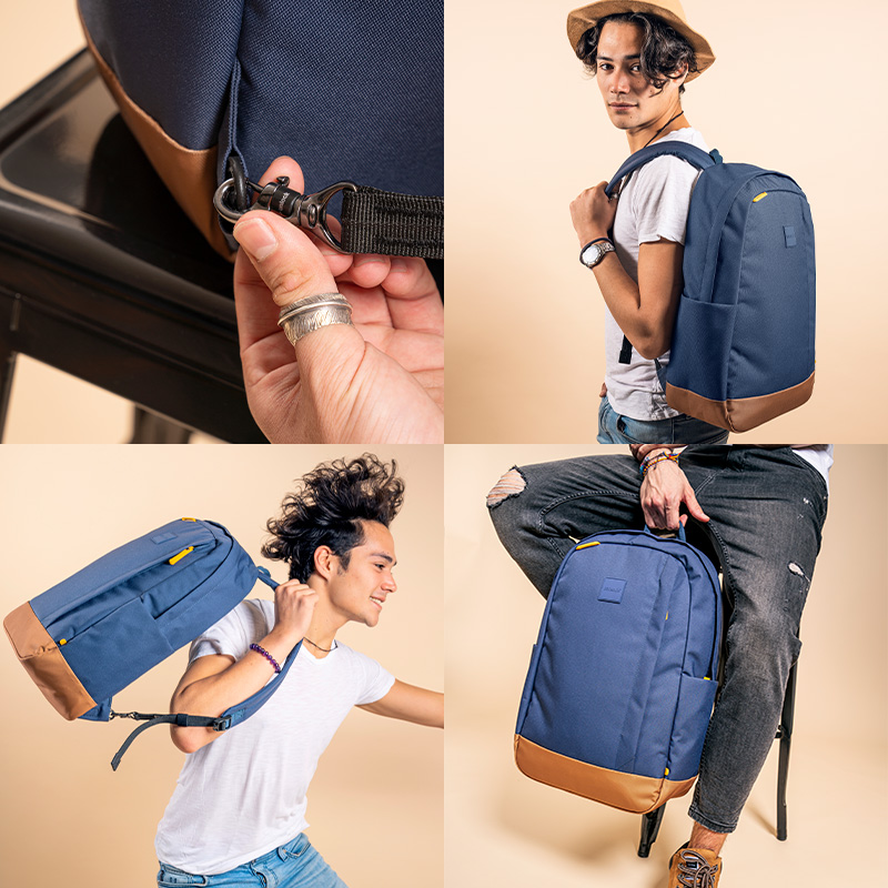 Model carrying bag with top handle. TurnNLock security hook. Model carrying the bag on one shoulder.