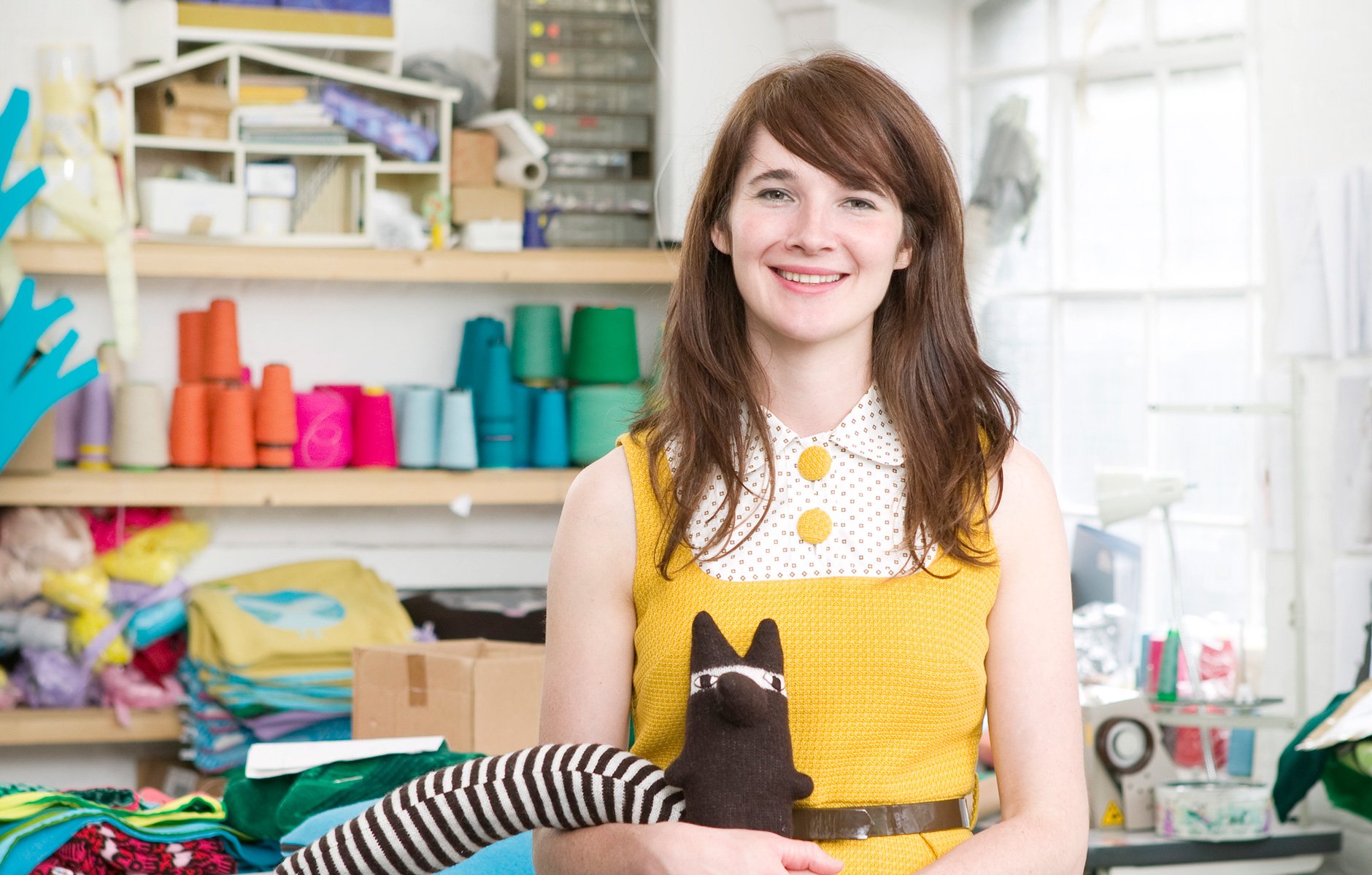 Portrait of Donna Wilson at her studio surrounded by her odd ball collection of 