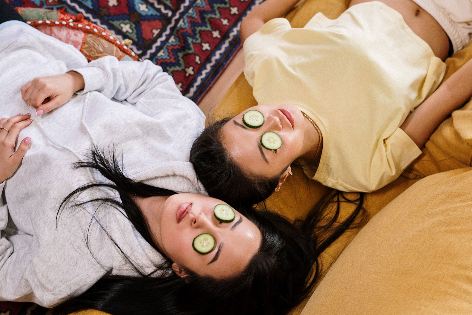 2 Girls with Cucumber Face Masks