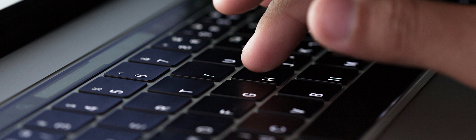 Finger typing on laptop