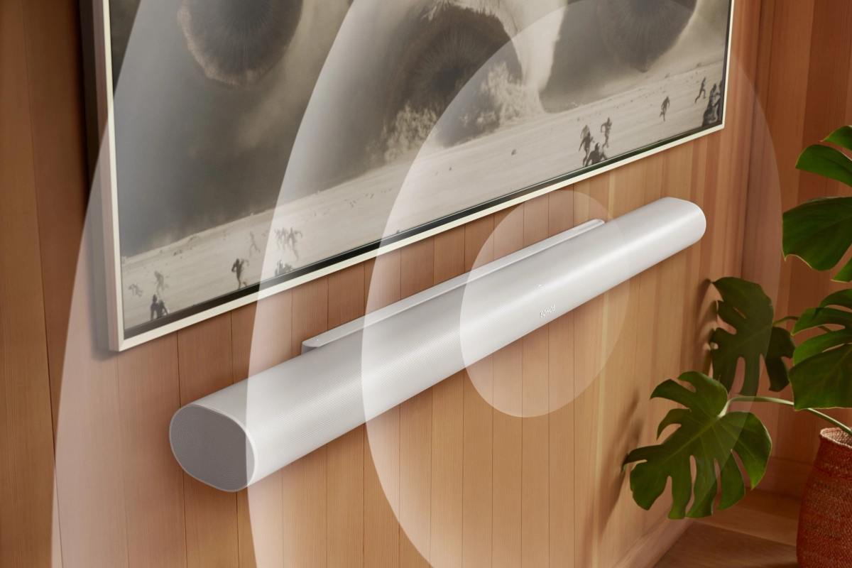 White Sonos Arc Ultra mounted below a TV in a living room