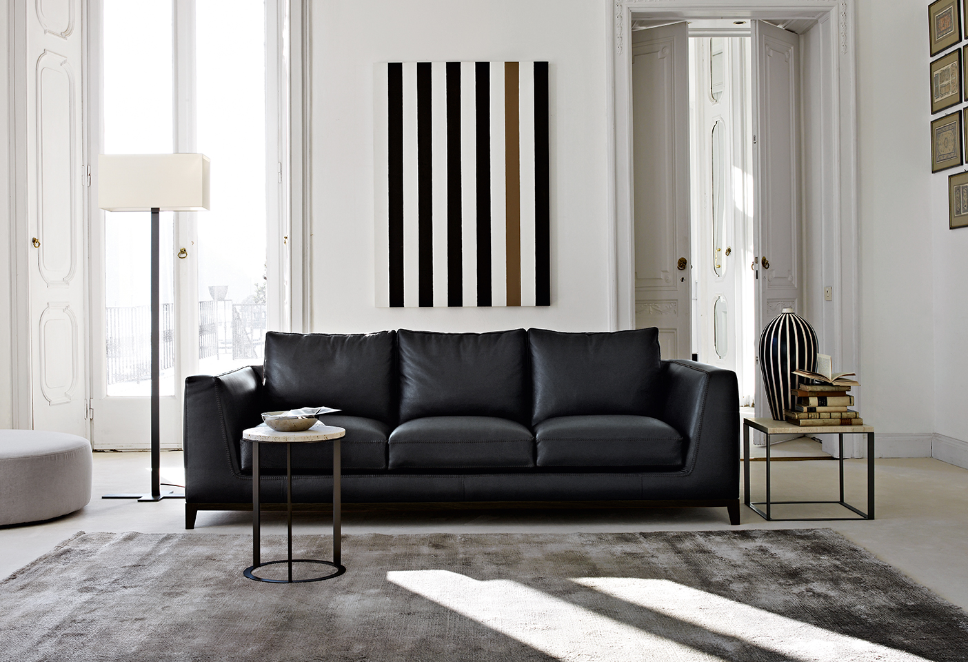 Artwork can often be a starting point for the overall colour palette. Image featuring Maxalto Lutetia sofa