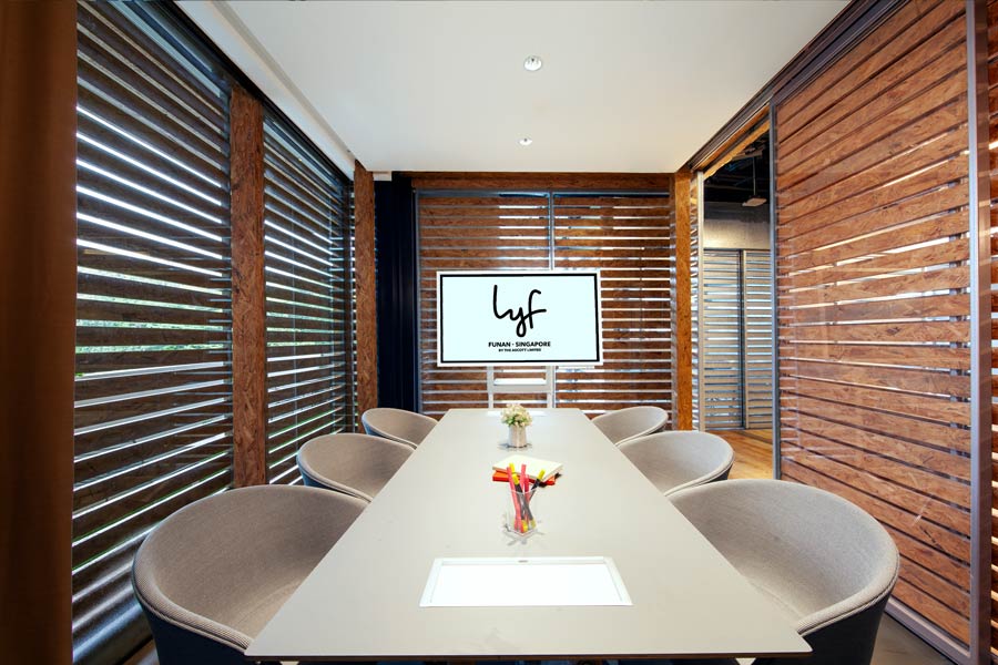 A Lyf Funan meeting room designed for hotel guests to share with their clients.