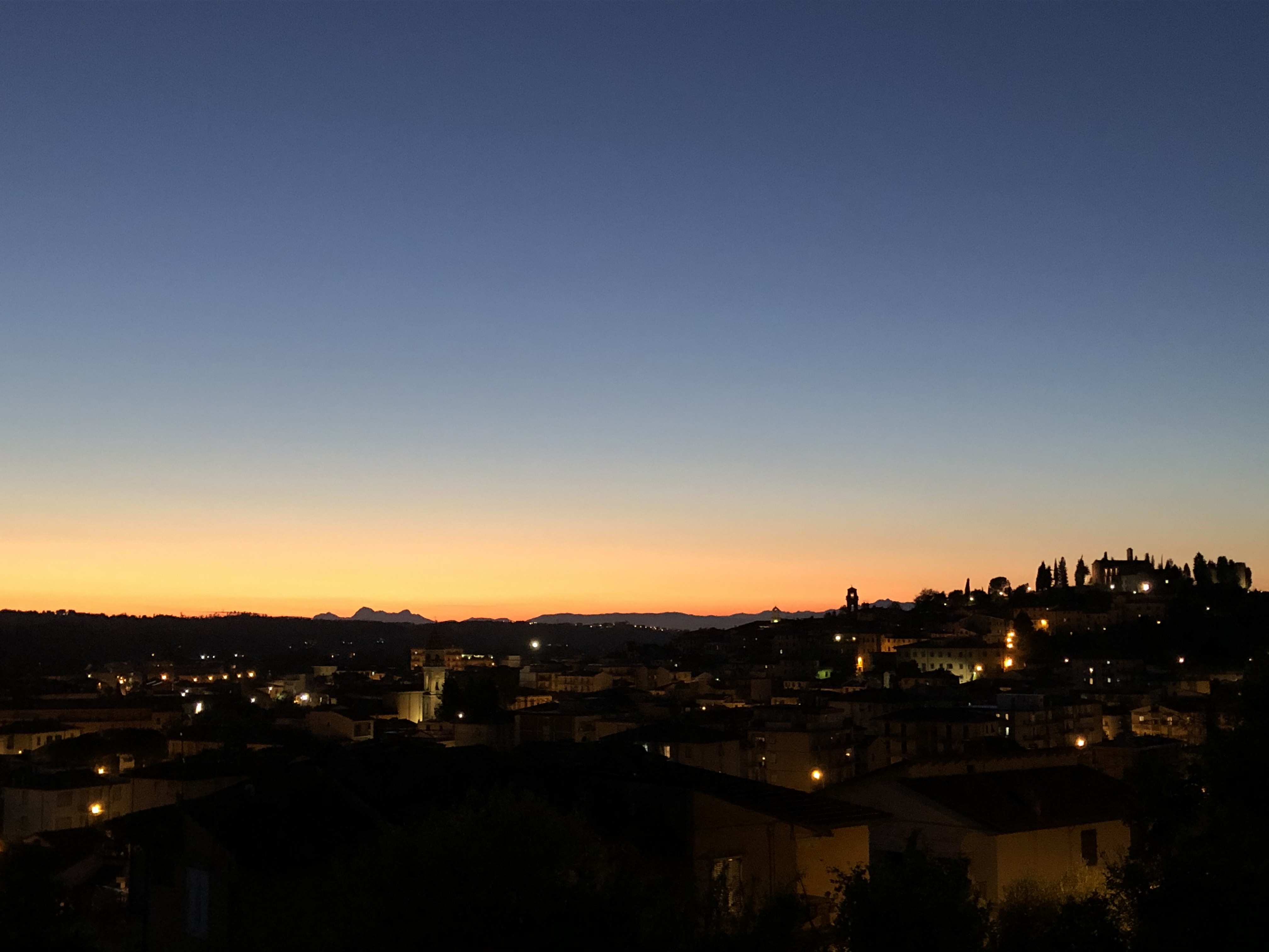 The view over Tuscany at dusk from Niccolò's home office. Photo c/o Niccolò Mazzei. 