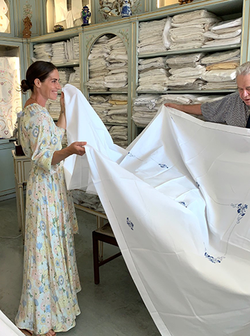 Rebecca de Ravenel in a shop with some beautiful Portuguese linen