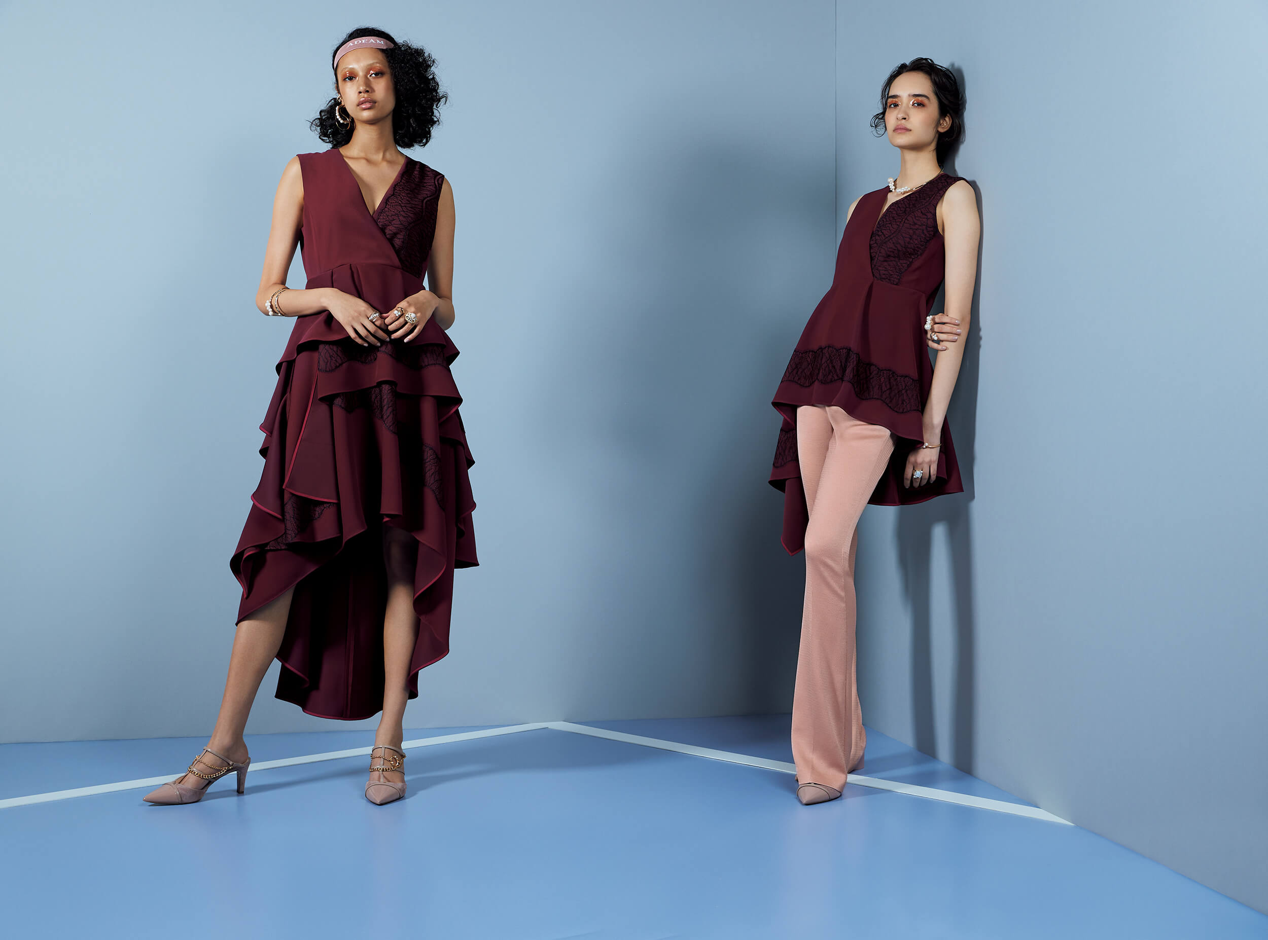 two models in maroon adeam outfits