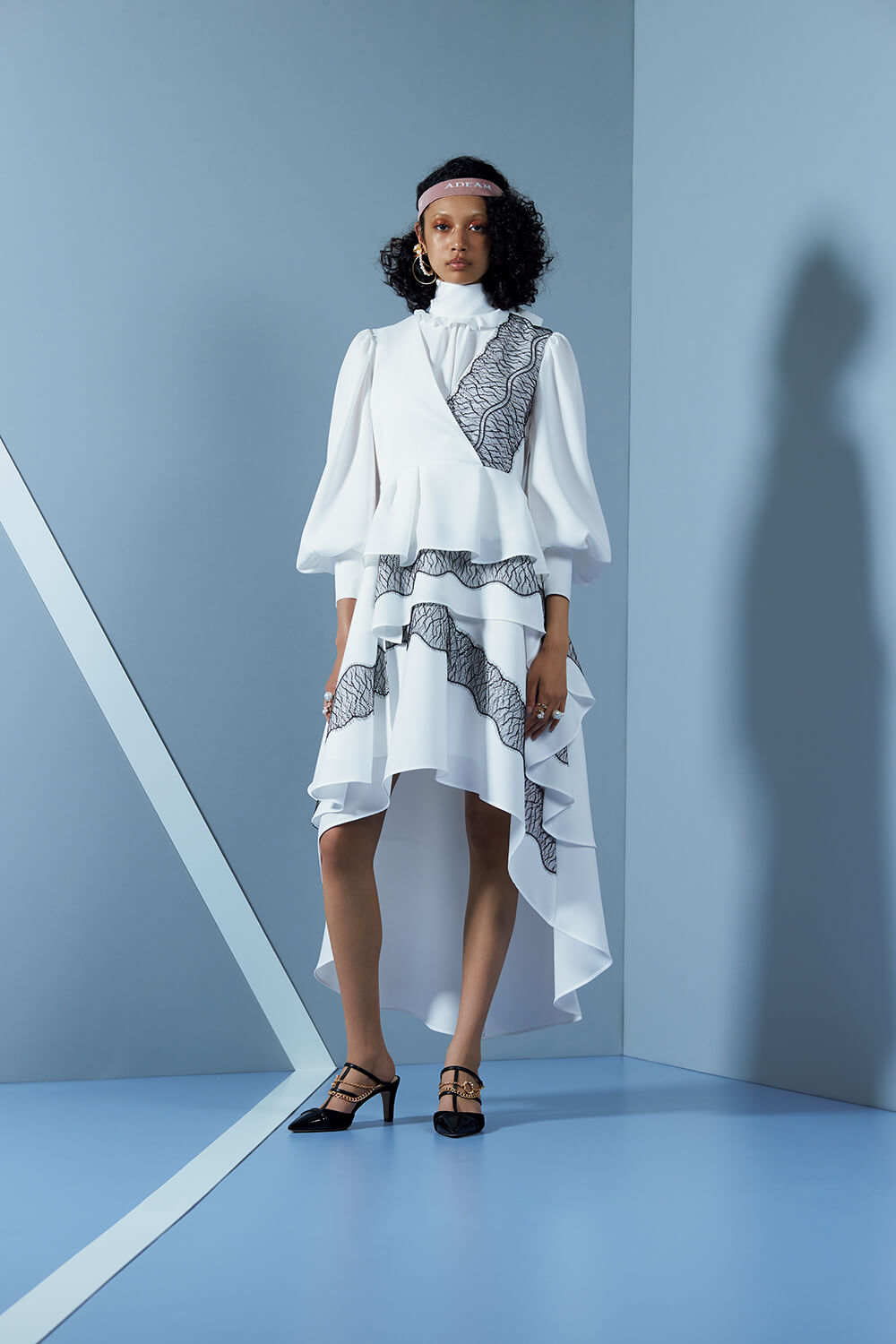 model in grey and white lace patterned set