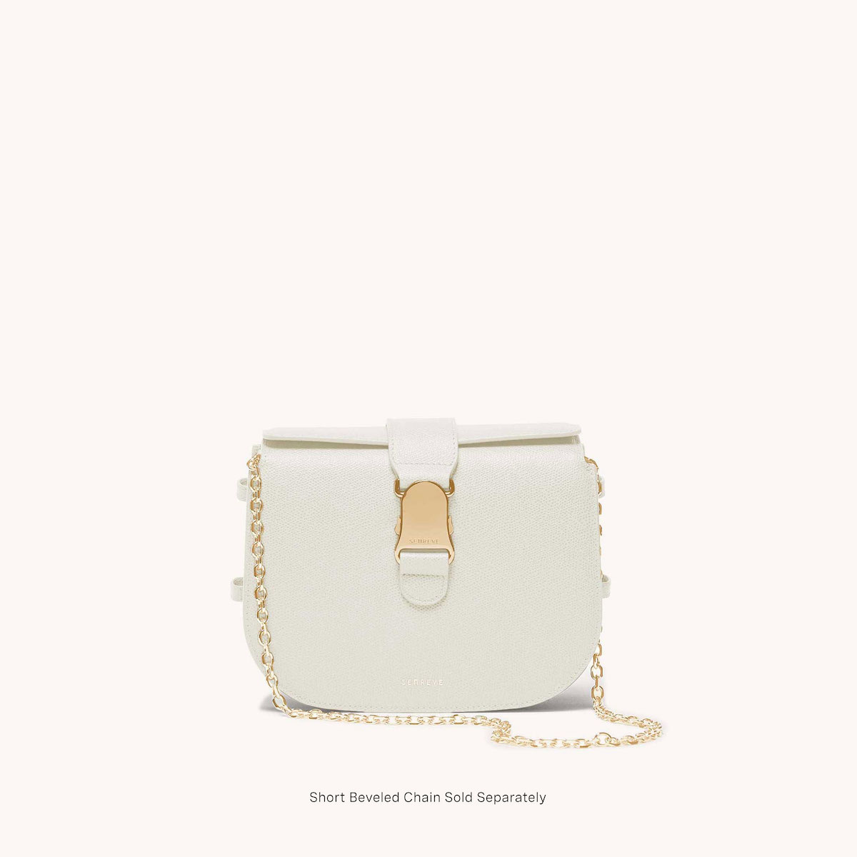 cadence crossbody pebbled cream front view with gold chain