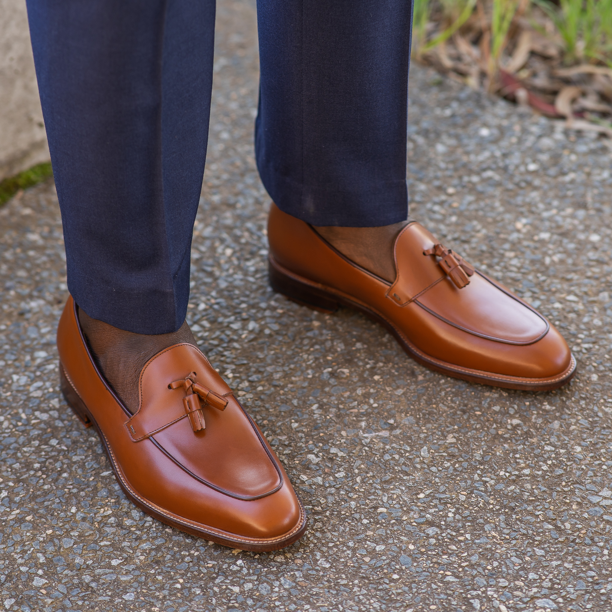 The Albert men’s tassel loafer in cognac paired with Italian bespoke blue suit