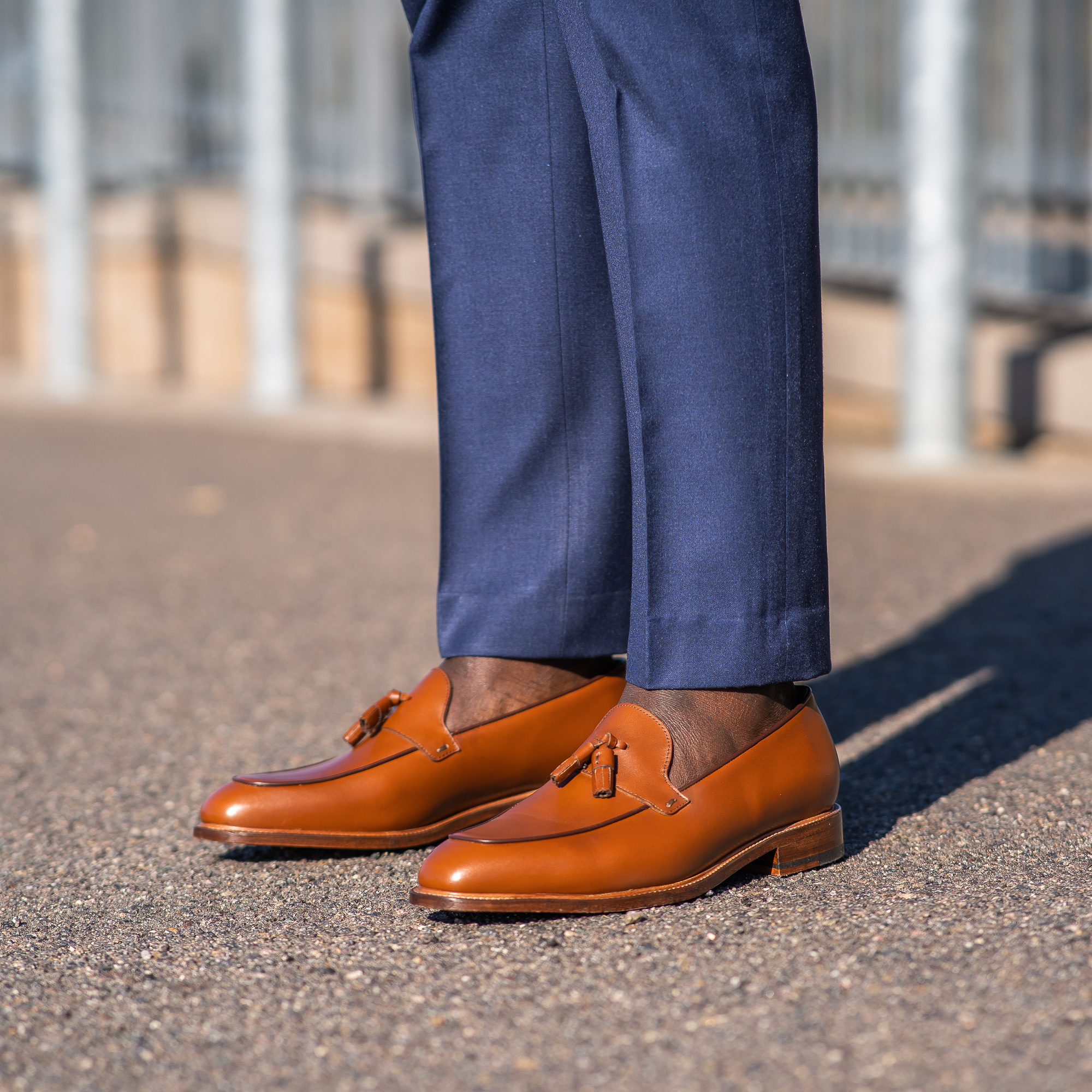 The Albert men’s tassel loafer in cognac paired with Italian bespoke blue suit