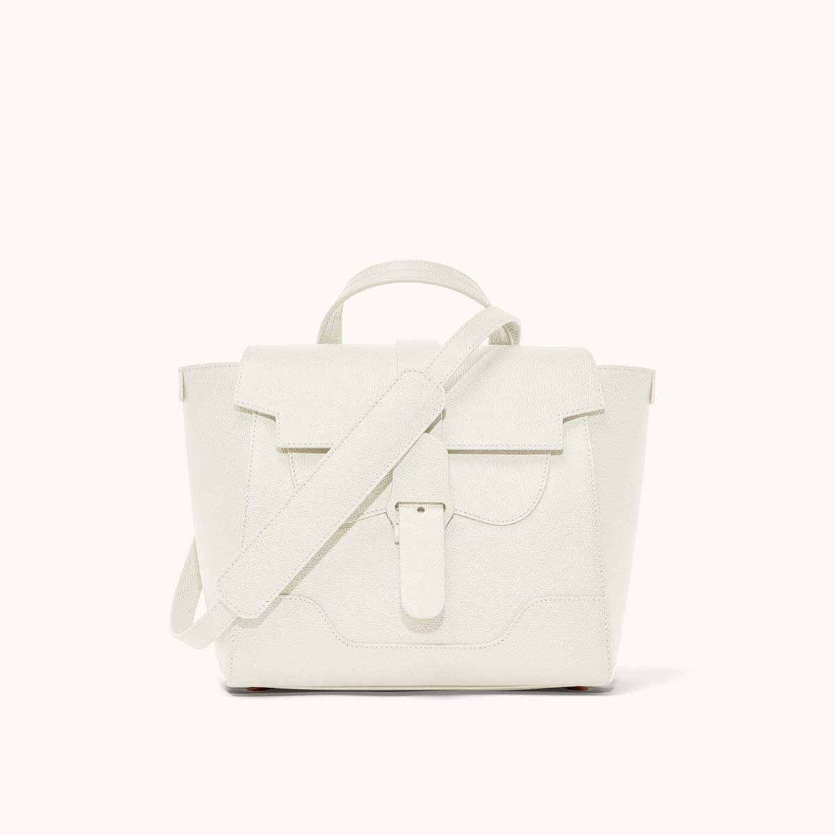 Midi Maestra Bag Pebbled Cream with Silver Hardware Front View with long strap draped over top