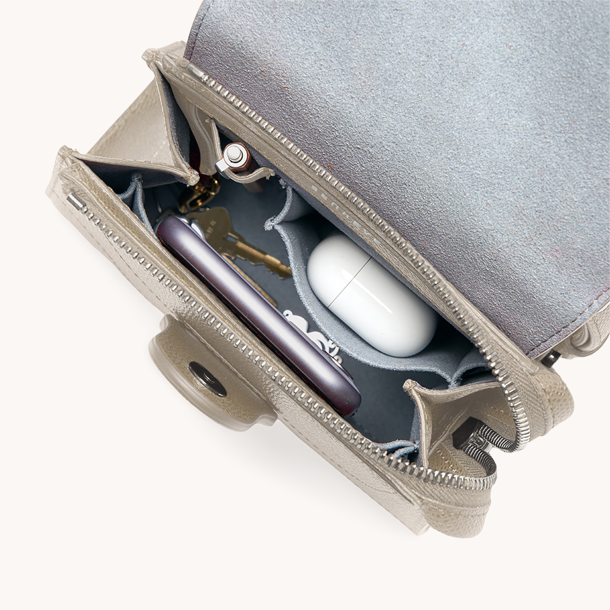 Mini Alunna Bag Pebbled Sand with Silver Hardware Interior View with What Fits: phone, AirPods, keys