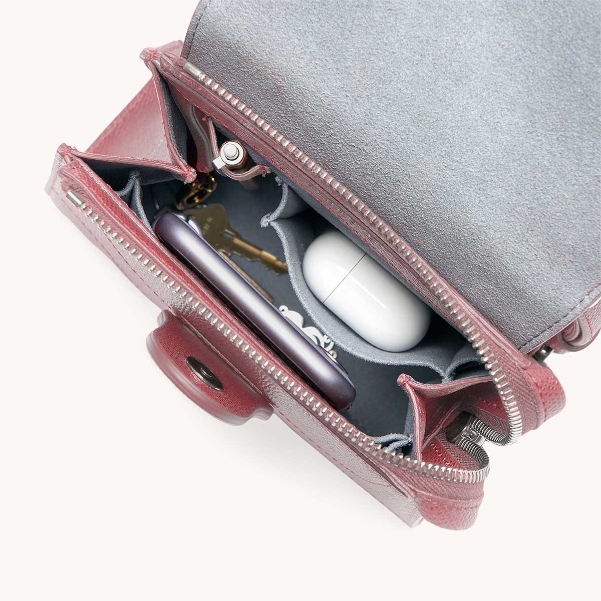Mini Alunna Bag Pebbled Mauve with Silver Hardware Interior View with What Fits: phone, AirPods, keys