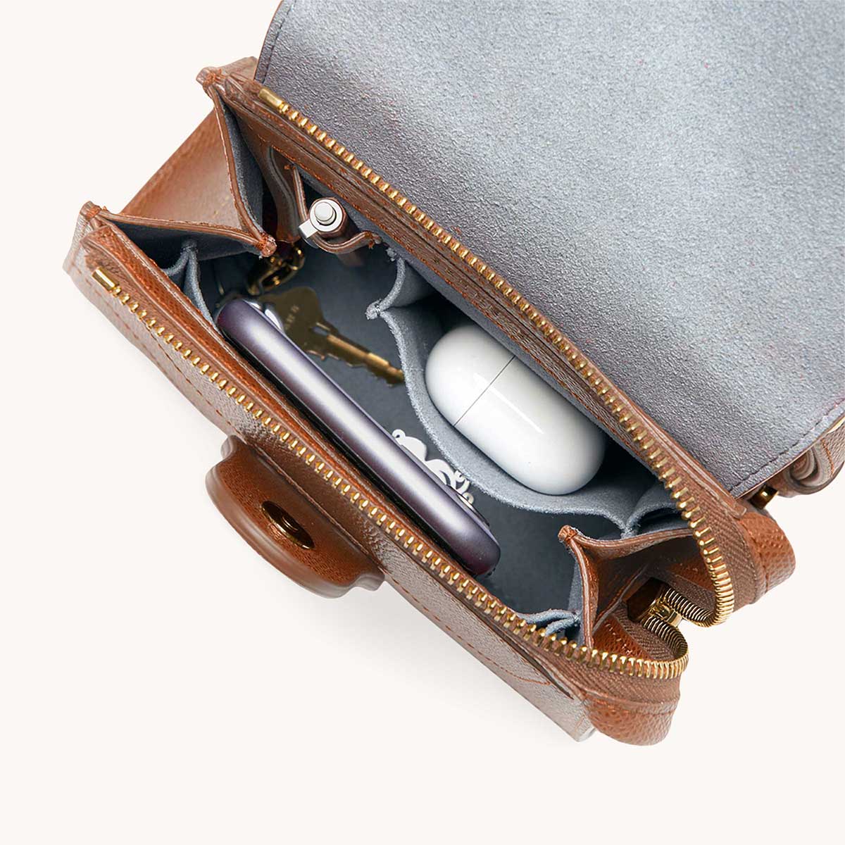 Mini Alunna Bag Pebbled Chestnut with Gold Hardware Interior View with What Fits: phone, AirPods, keys