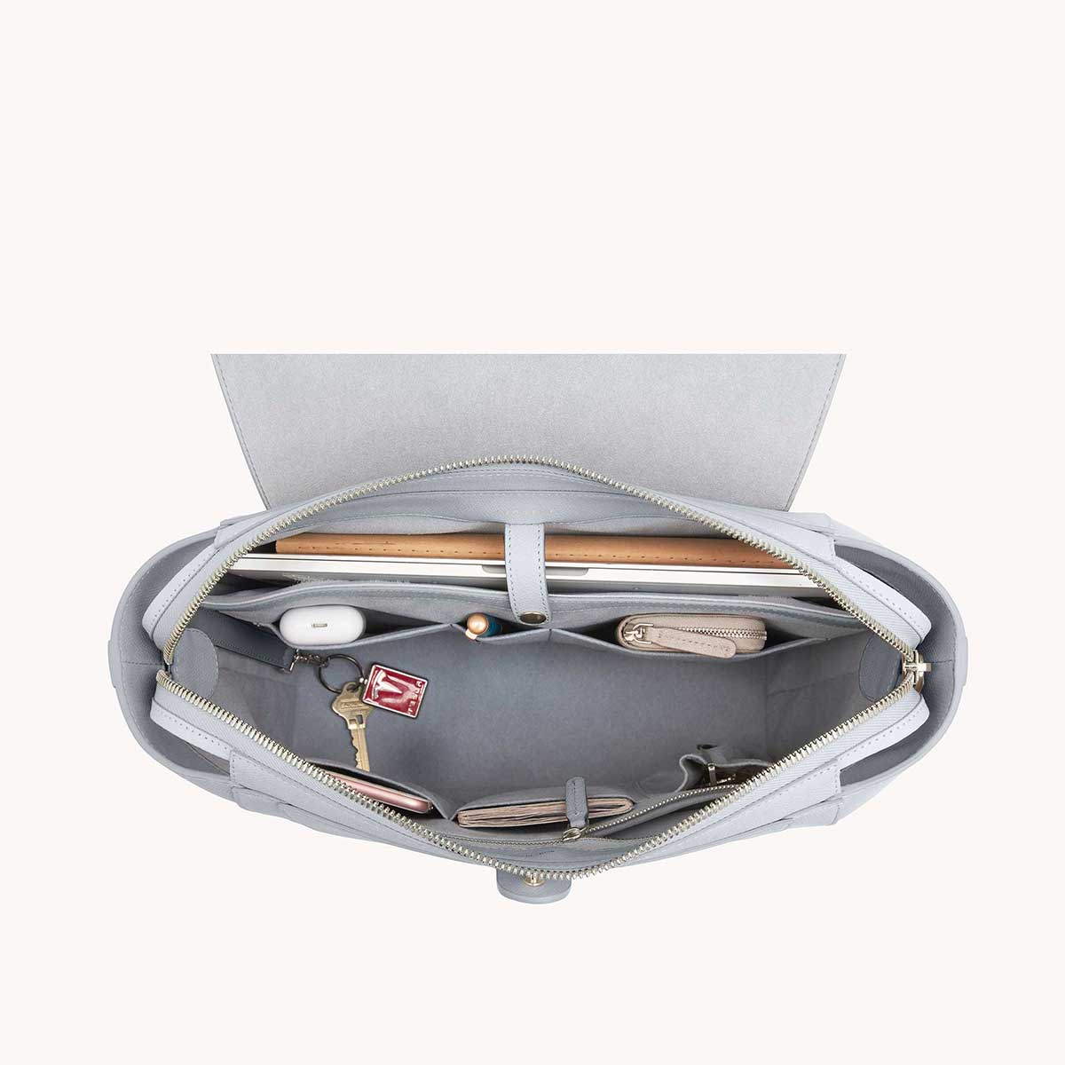 Maestra Bag Pebbled Ice with Silver Hardware Interior View with What Fits: laptop, cards, phone, keys, etc.