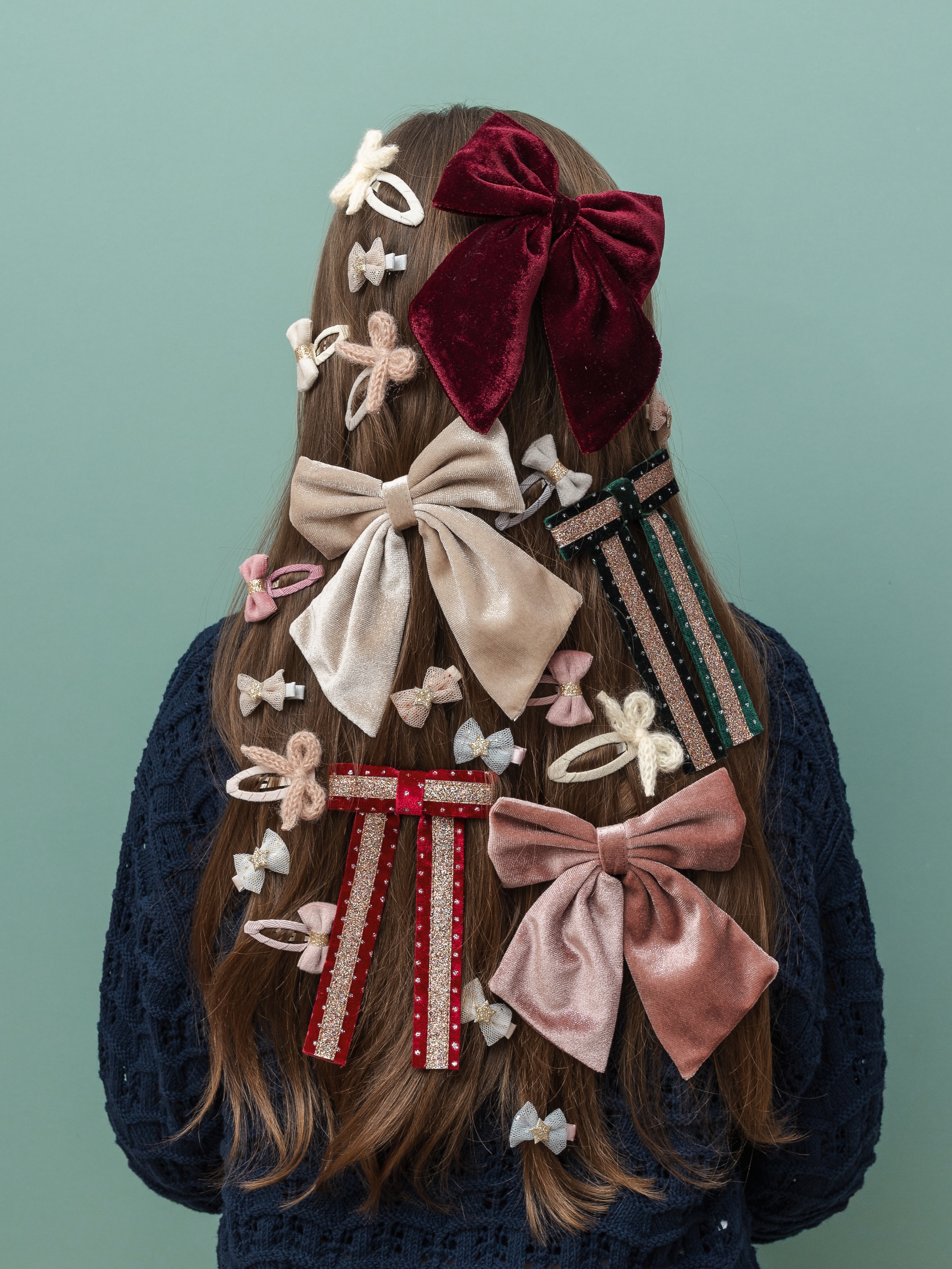 girl with multiple bows in her hair