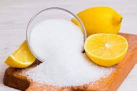 a bowl of salt and lemons