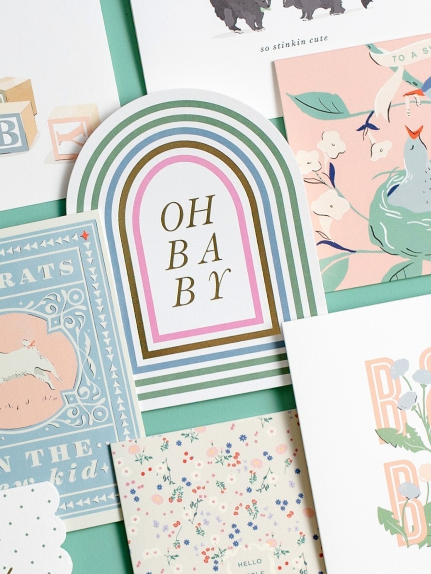 pile of baby cards, middle card says 