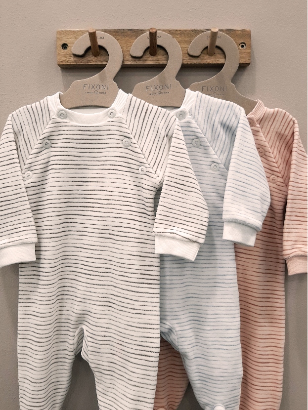 3 fixoni footies hanging on hangers