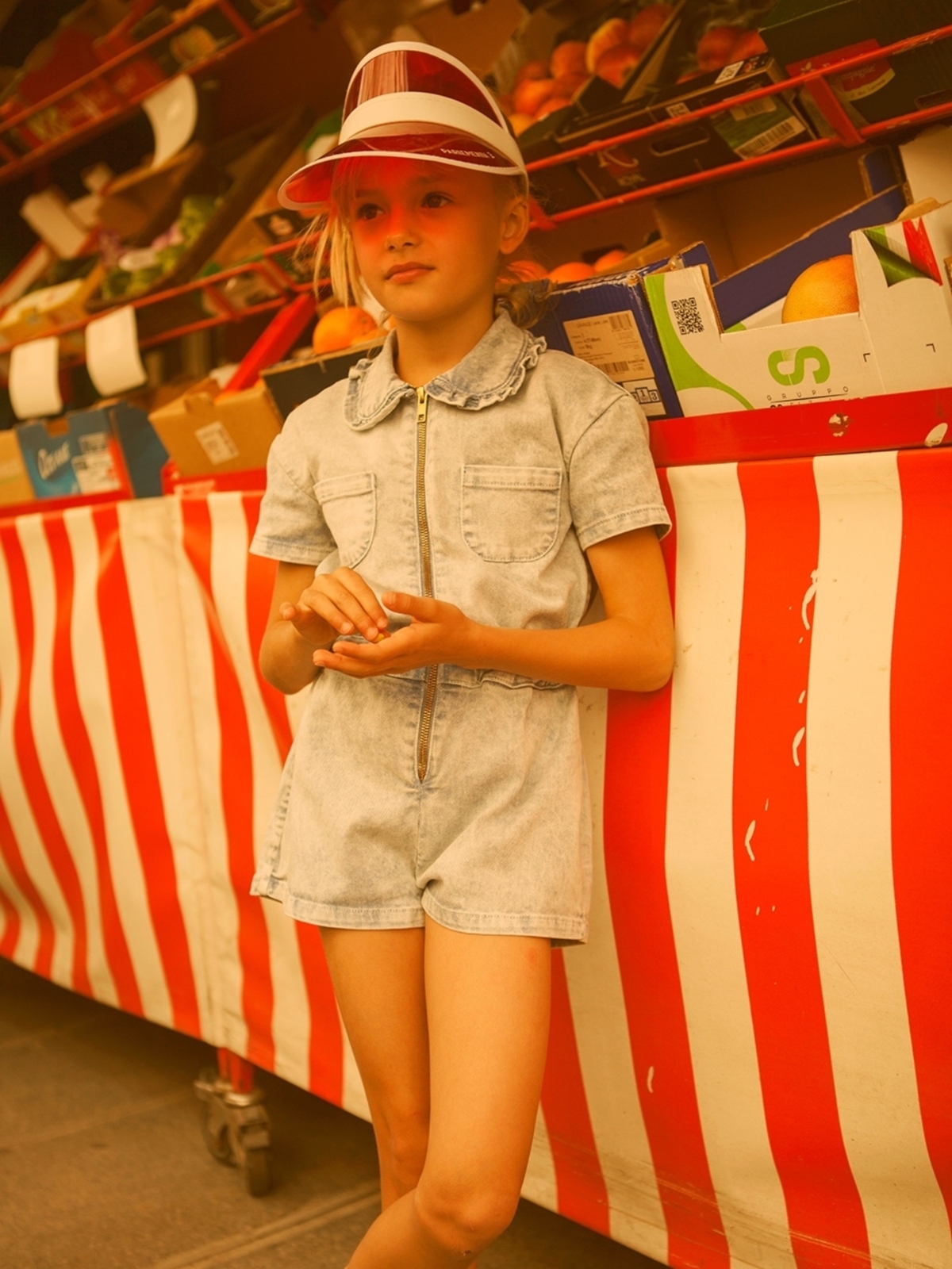 girl wearing denim romper