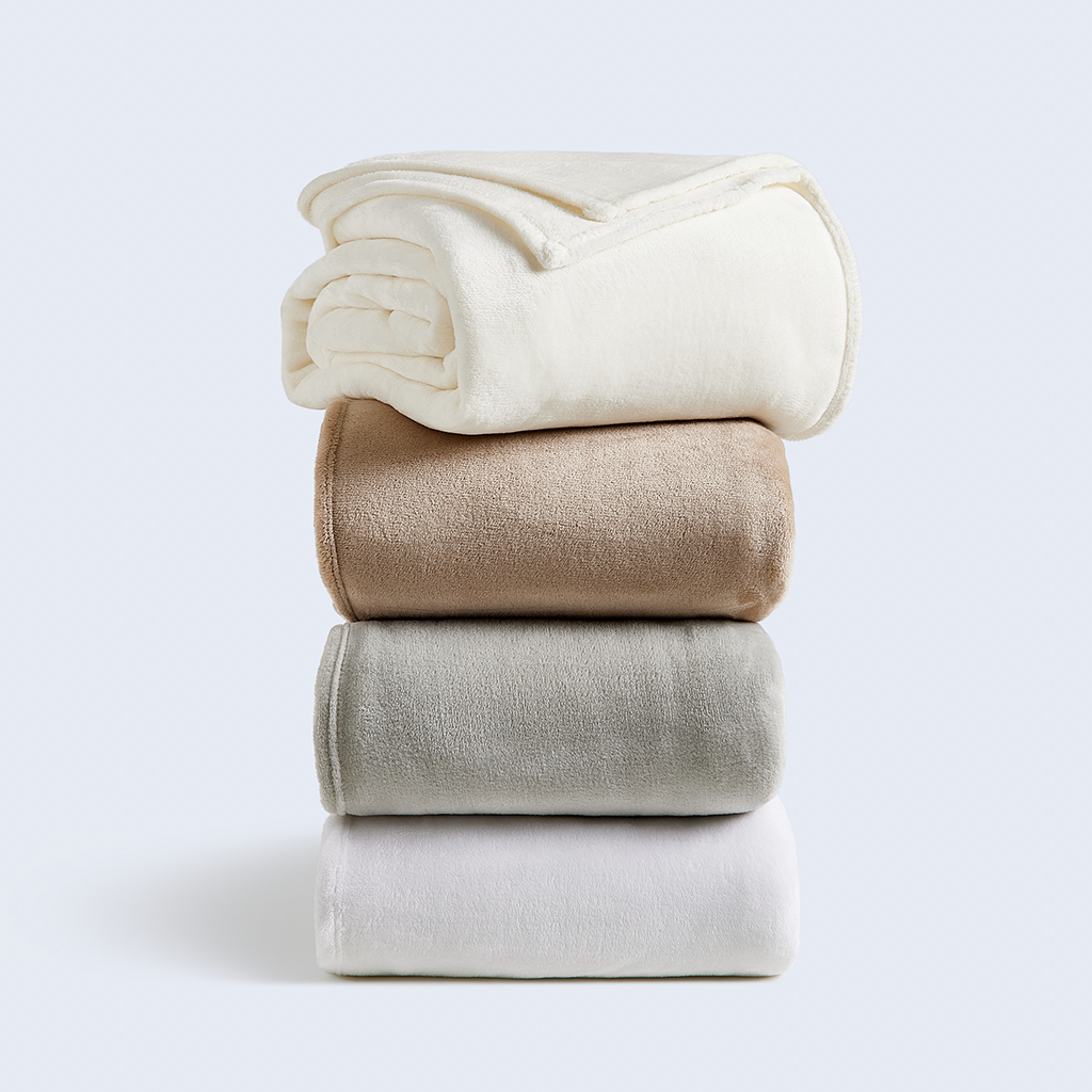 A stack of Cosy House Collection Everyday Fleece Blankets.