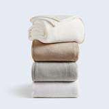 A stack of Cosy House Collection Everyday Fleece Blankets.
