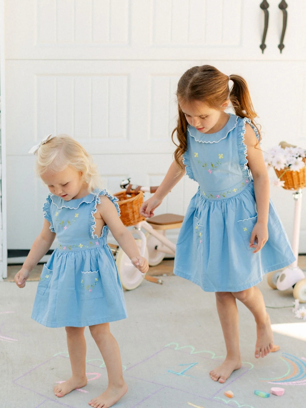 2 girls wearing the new society exclusive dress