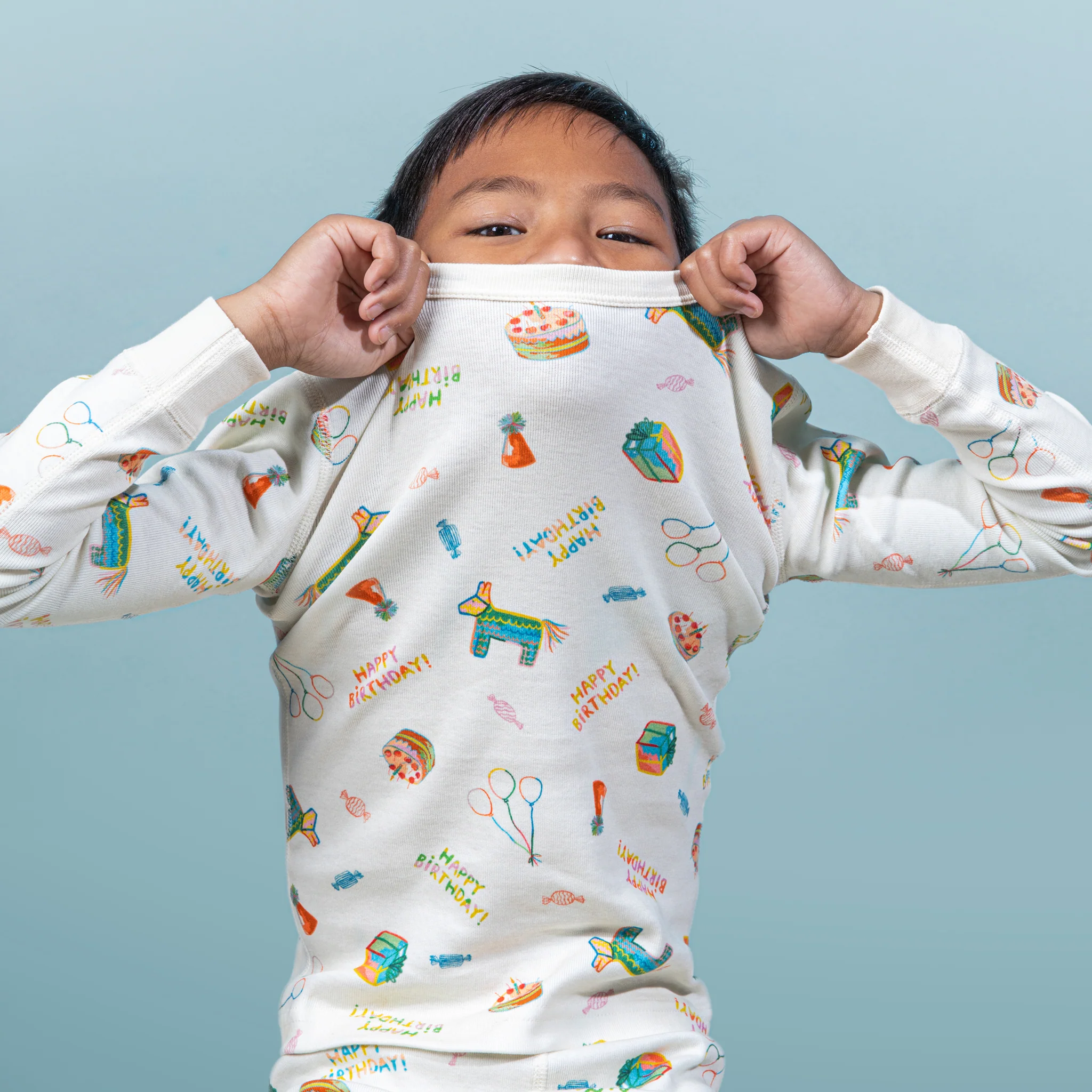 young boy wearing happy birthday pajamas