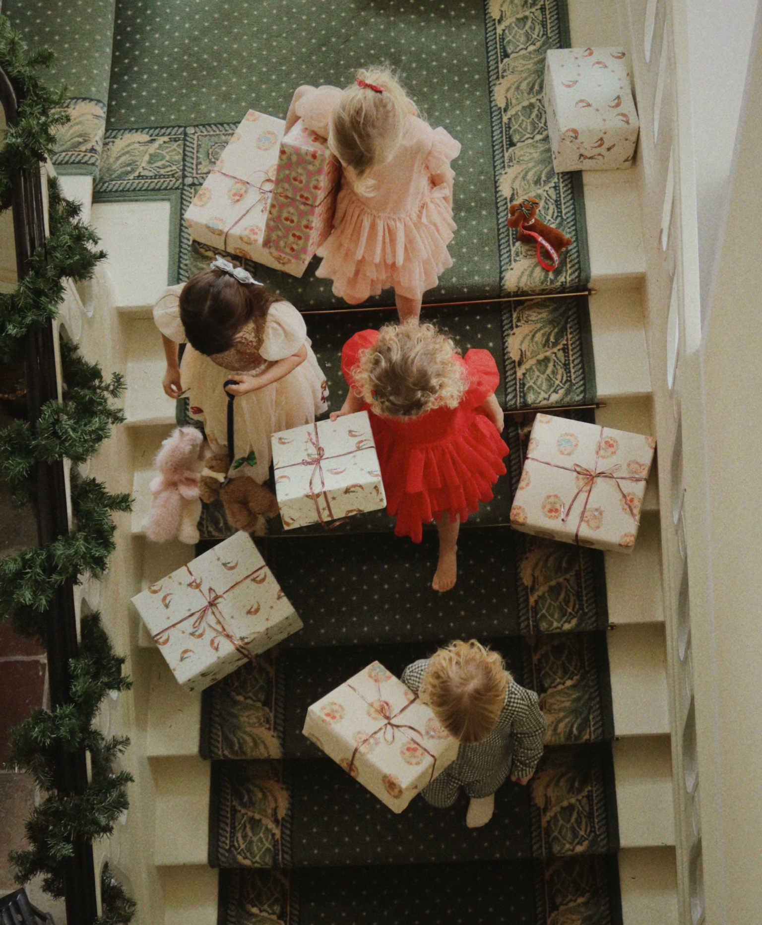 KIDS ON STAIRCASE HOLDING PRESENTS