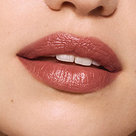Light model wearing Persuasive Lipstick