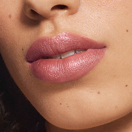 Medium model wearing Demure Lipstick