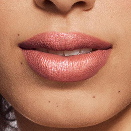 Medium model wearing Enigmatic Lipstick