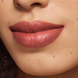 Medium model wearing Persuasive Lipstick