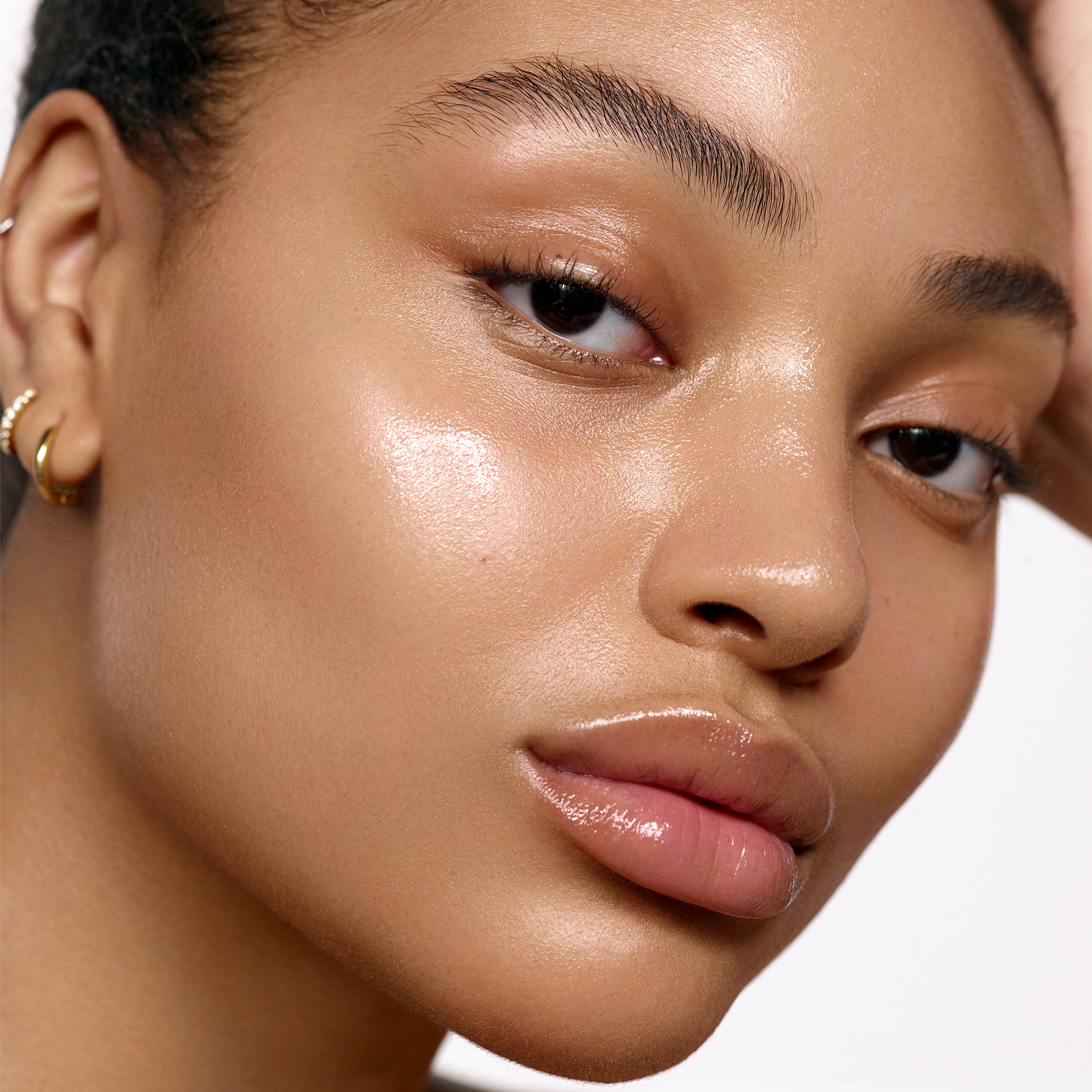 Image of model wearing the Solar Power Luminous SPF 30 serum product on her skin.