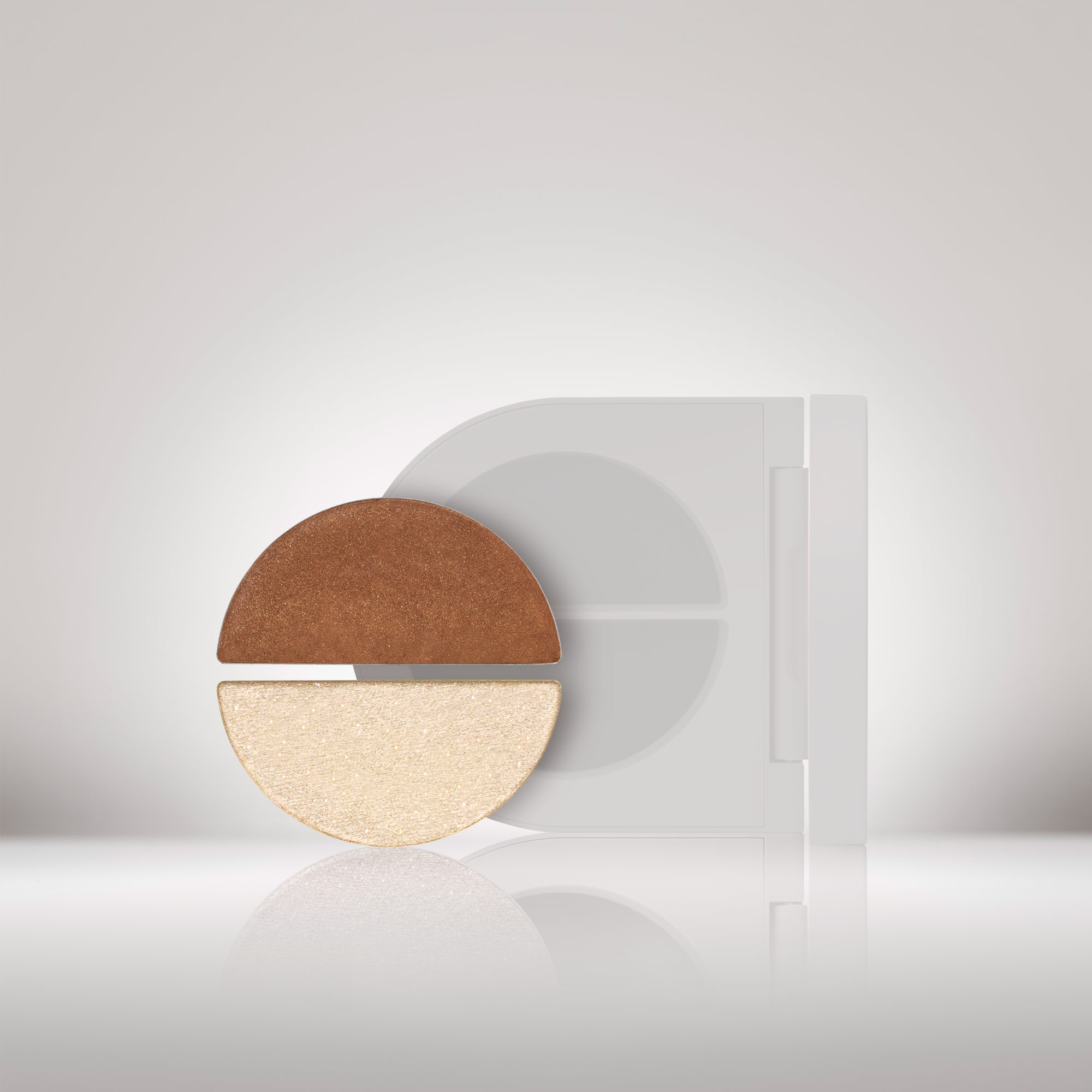 Silhouette of refill compact featuring both the Satin Cocoa and White Gold Shimmer. 