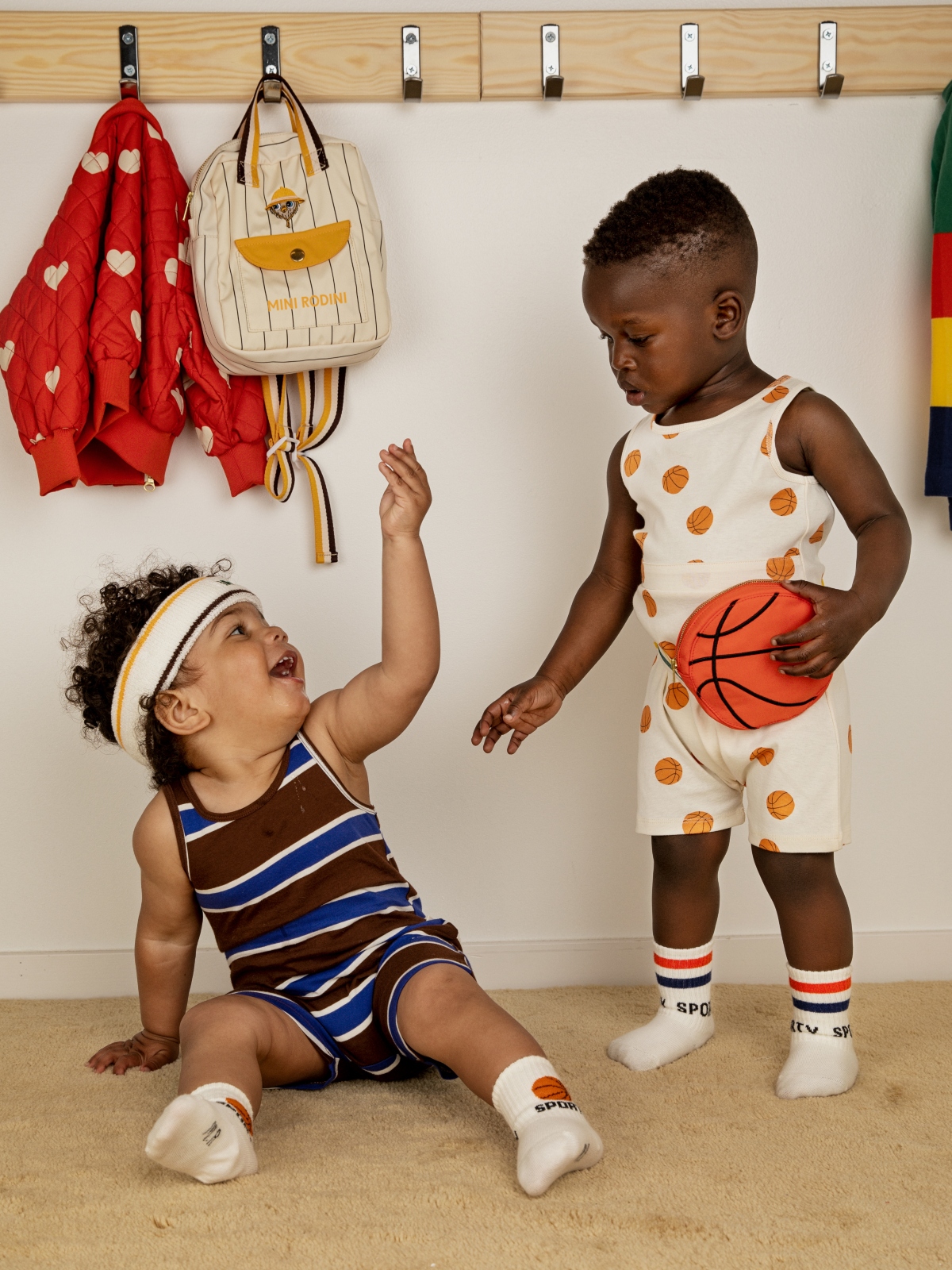 two young boys holding basketball