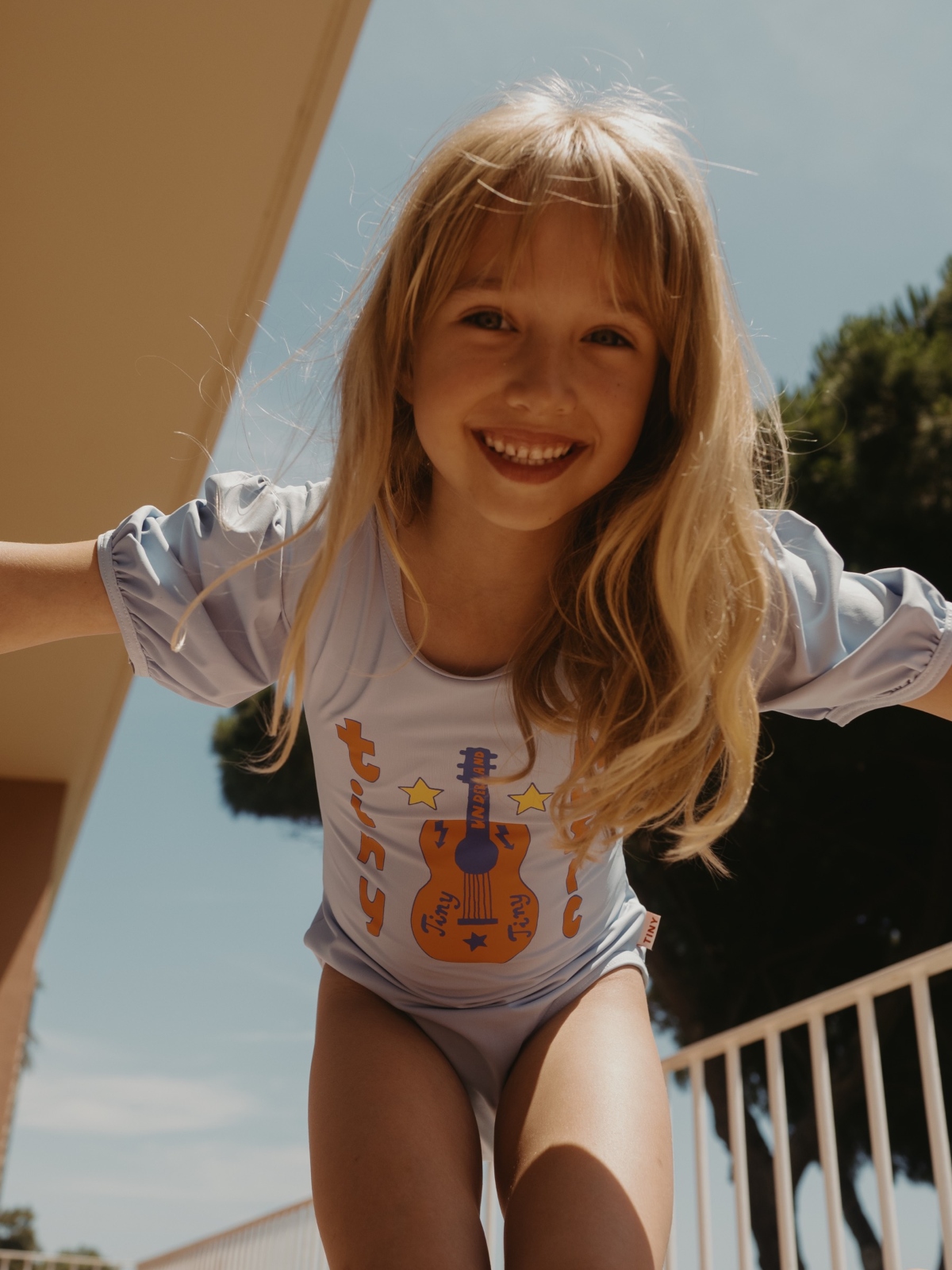 girl wearing tiny cottons one-piece swimsuit