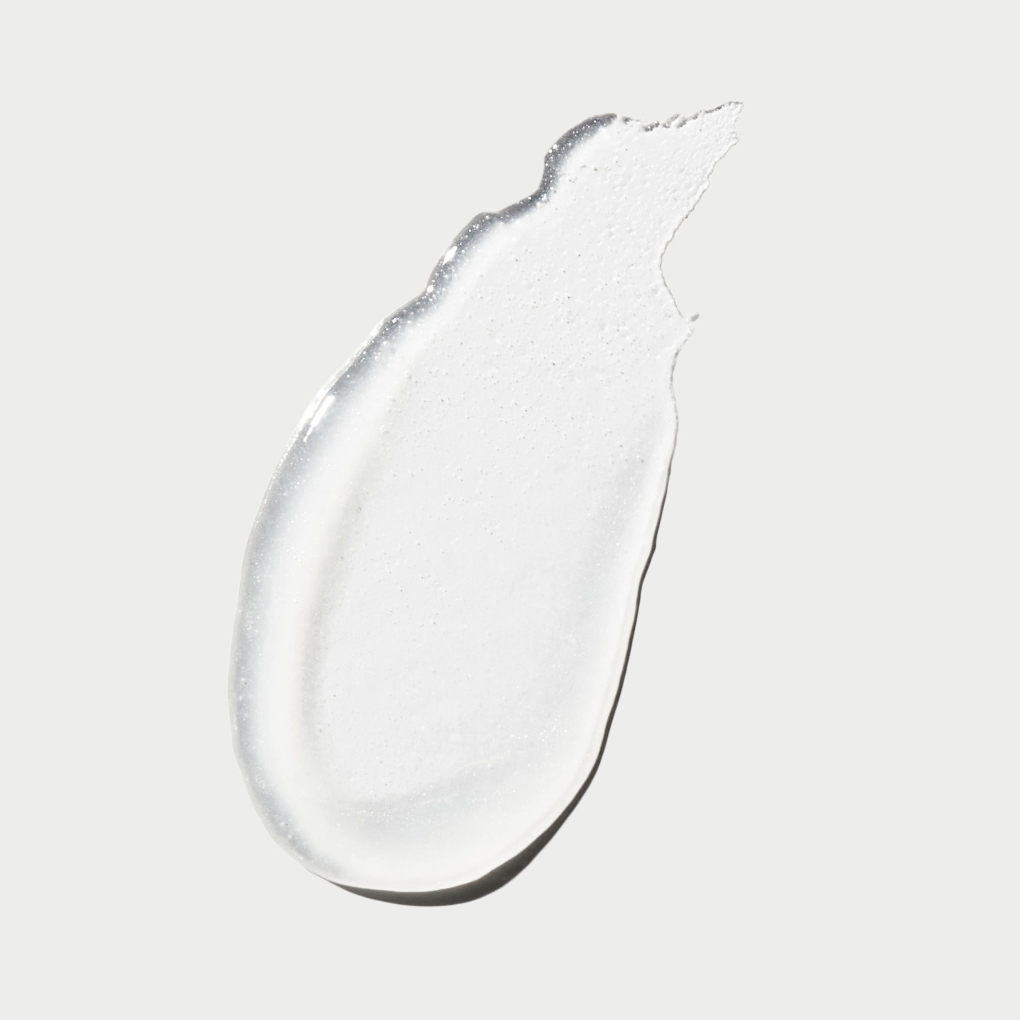 Macro image showing luxe smooth texture of lip treatment balm.