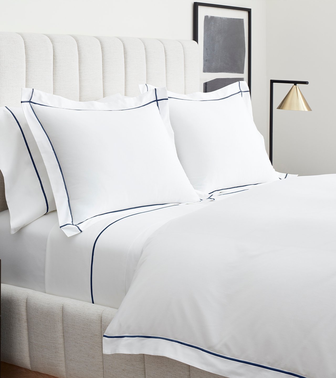 Bed made with Embroidered Sheet & Duvet Set in White/Navy