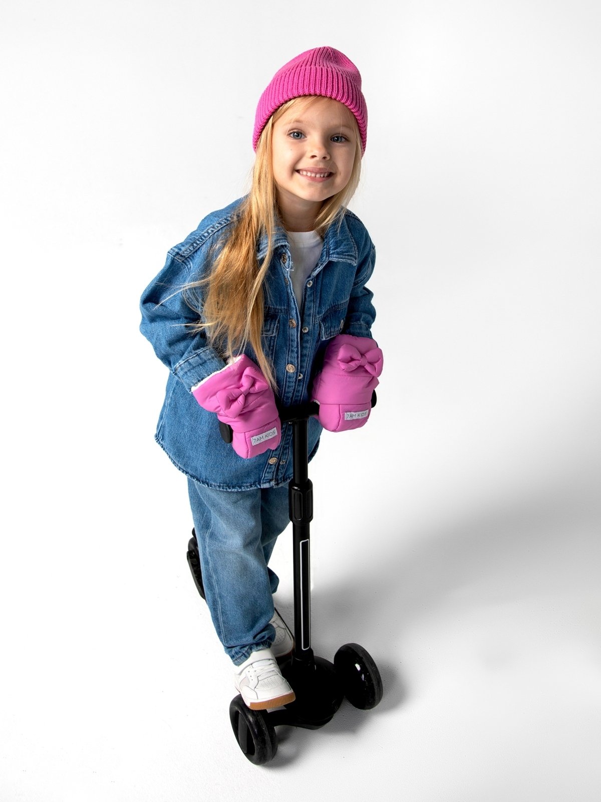 girl riding scooter wearnig 7am enfant pink kids scooter warmmuffs