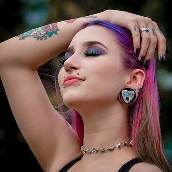 Girl wearing unique Ouija Design Stainless Steel Ear Tunnel