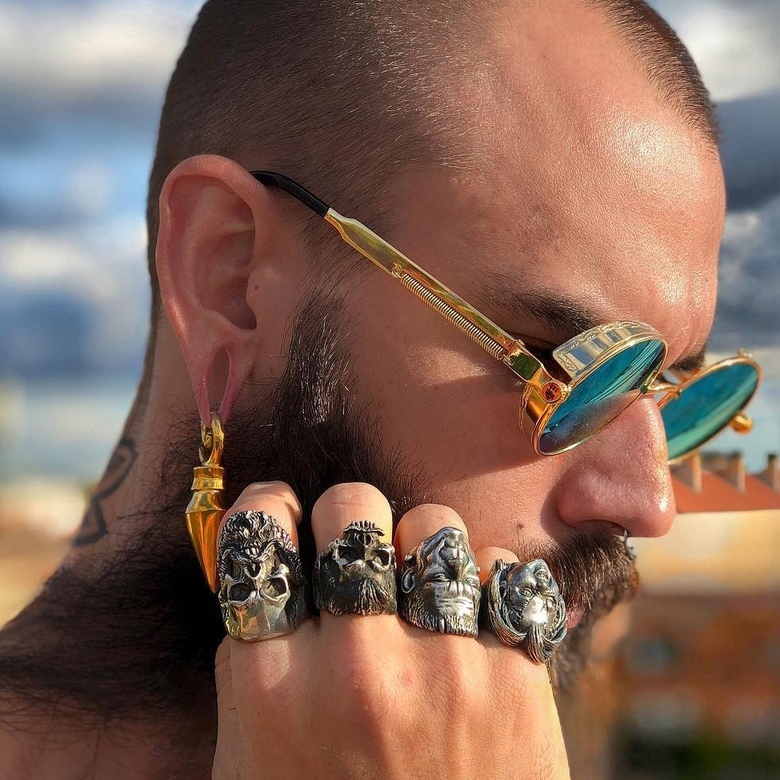 Man wearing unique  Pyramid - Brass Ear Weights (Pair)