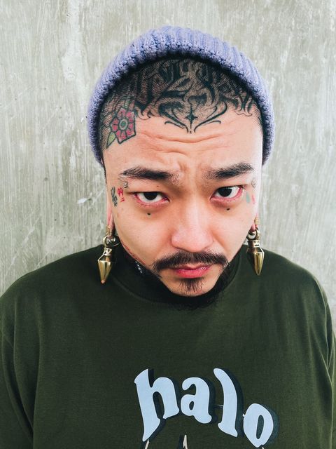 Man wearing cool  Pyramid - Brass Ear Weights (Pair)